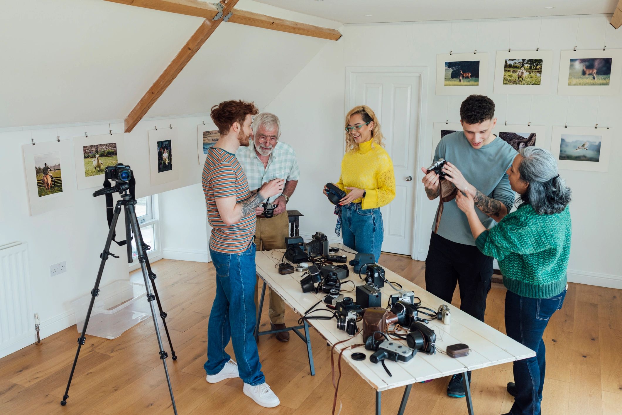 Creative team reviewing cameras and production equipment